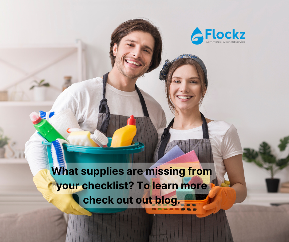 Two people holding cleaning supplies in their hands.